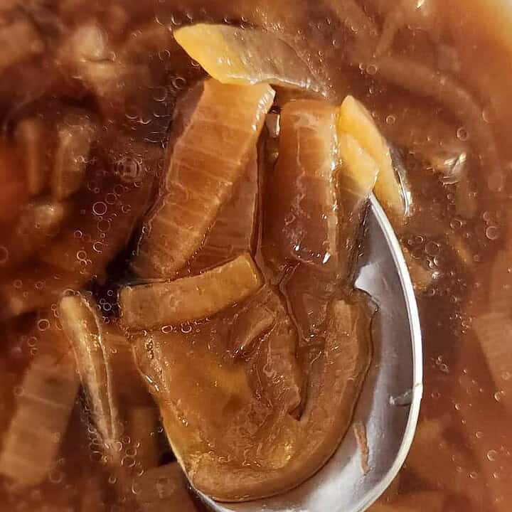 French onion soup in a bowl with a spoon