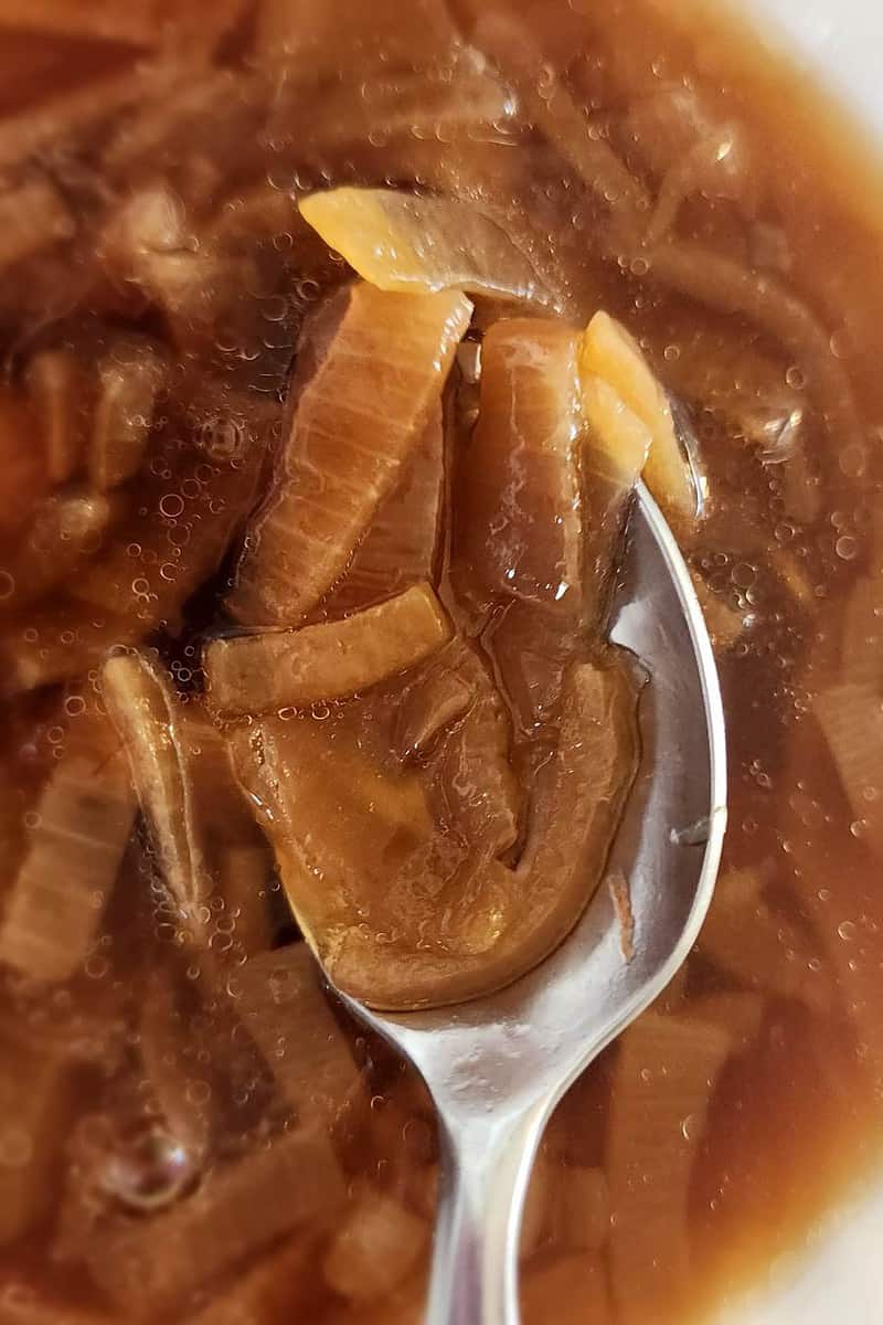 French onion soup in a bowl with a spoon