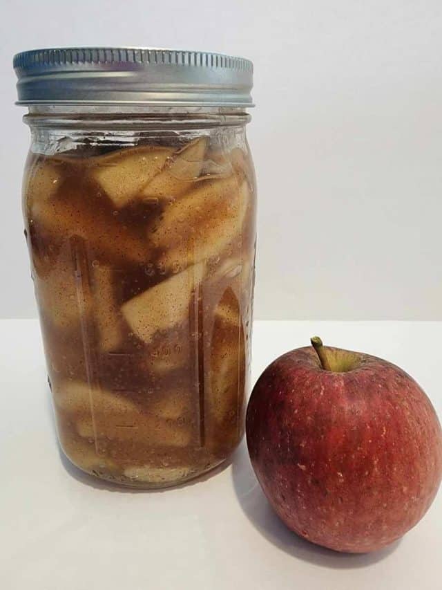 Jar of apple pie filling with apple