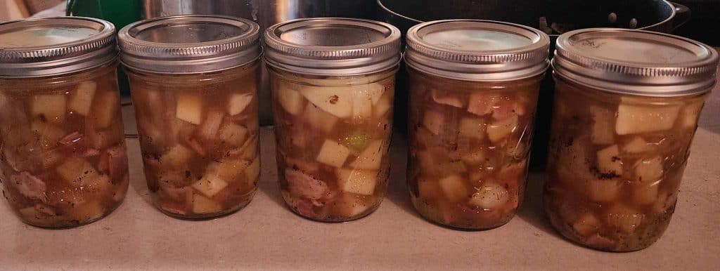 Jars of loaded potato soup before canning