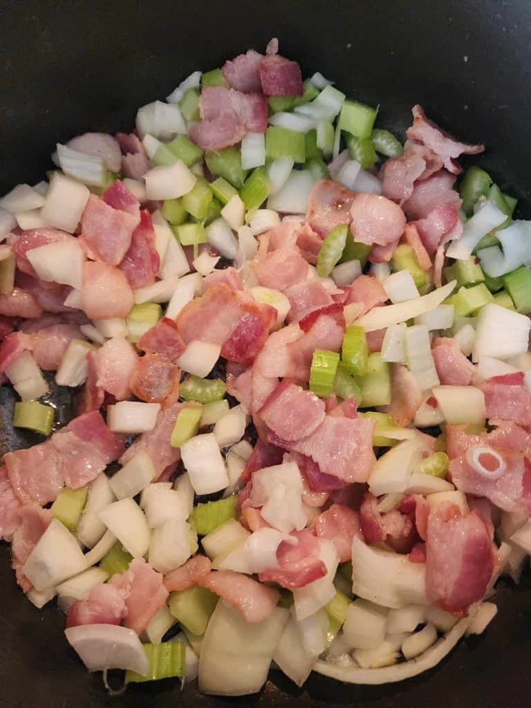 bacon, celery and onions cooking for loaded potato soup canning recipe