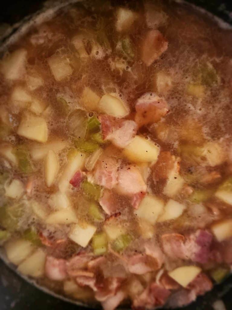 loaded potato soup simmering before canning