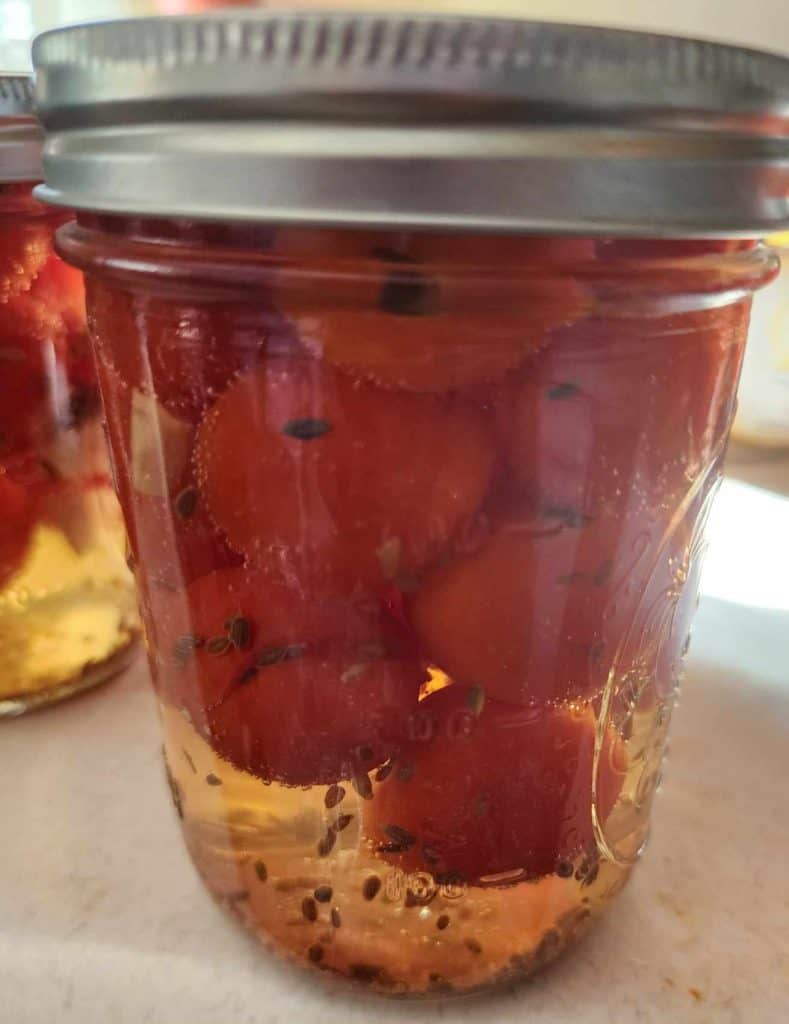 jar of pickled cherry tomatoes
