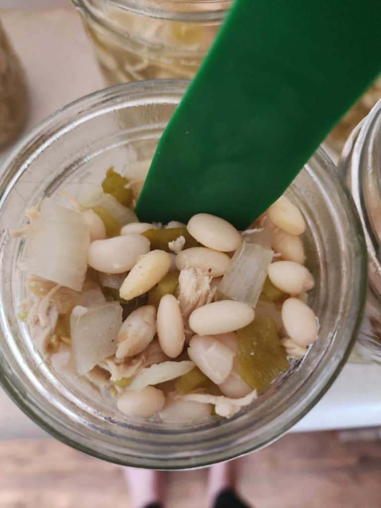 Removing air bubbles from jar of white chicken chili