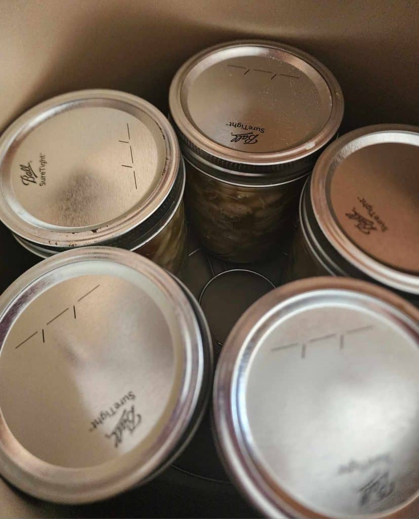 Jars of white chicken chili in the pressure canner