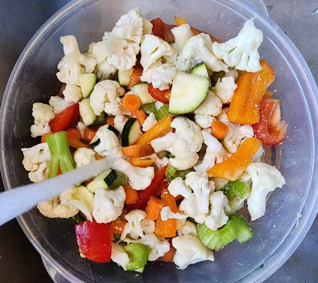 Adding water to mixed vegetables for canning pickled giardiniera