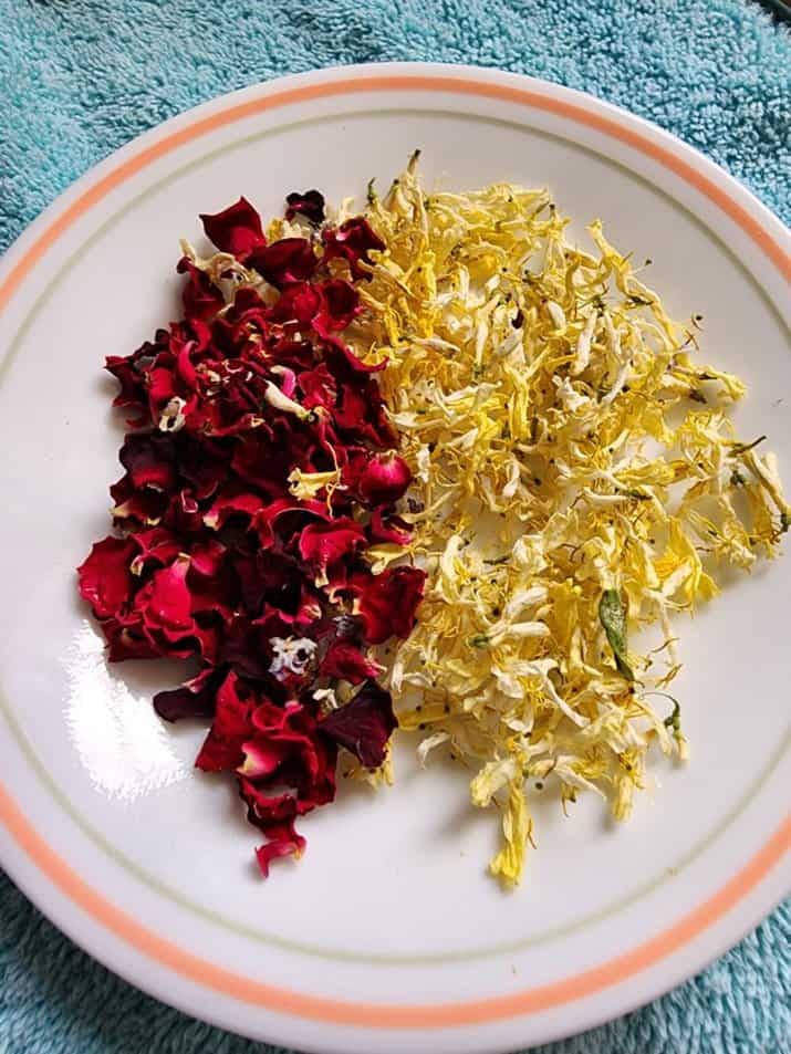 Dried rose and honeysuckle flowers to make honeysuckle rose infused oil for honeysuckle rose salve