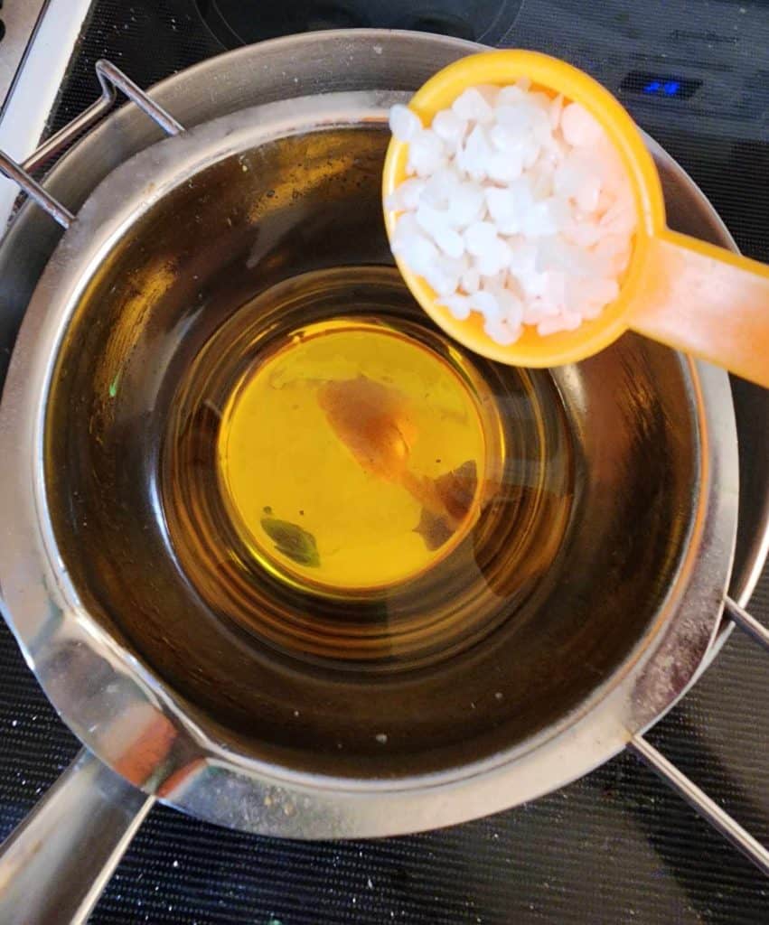 Adding beeswax to lemon balm infused oil to make lemon balm salve