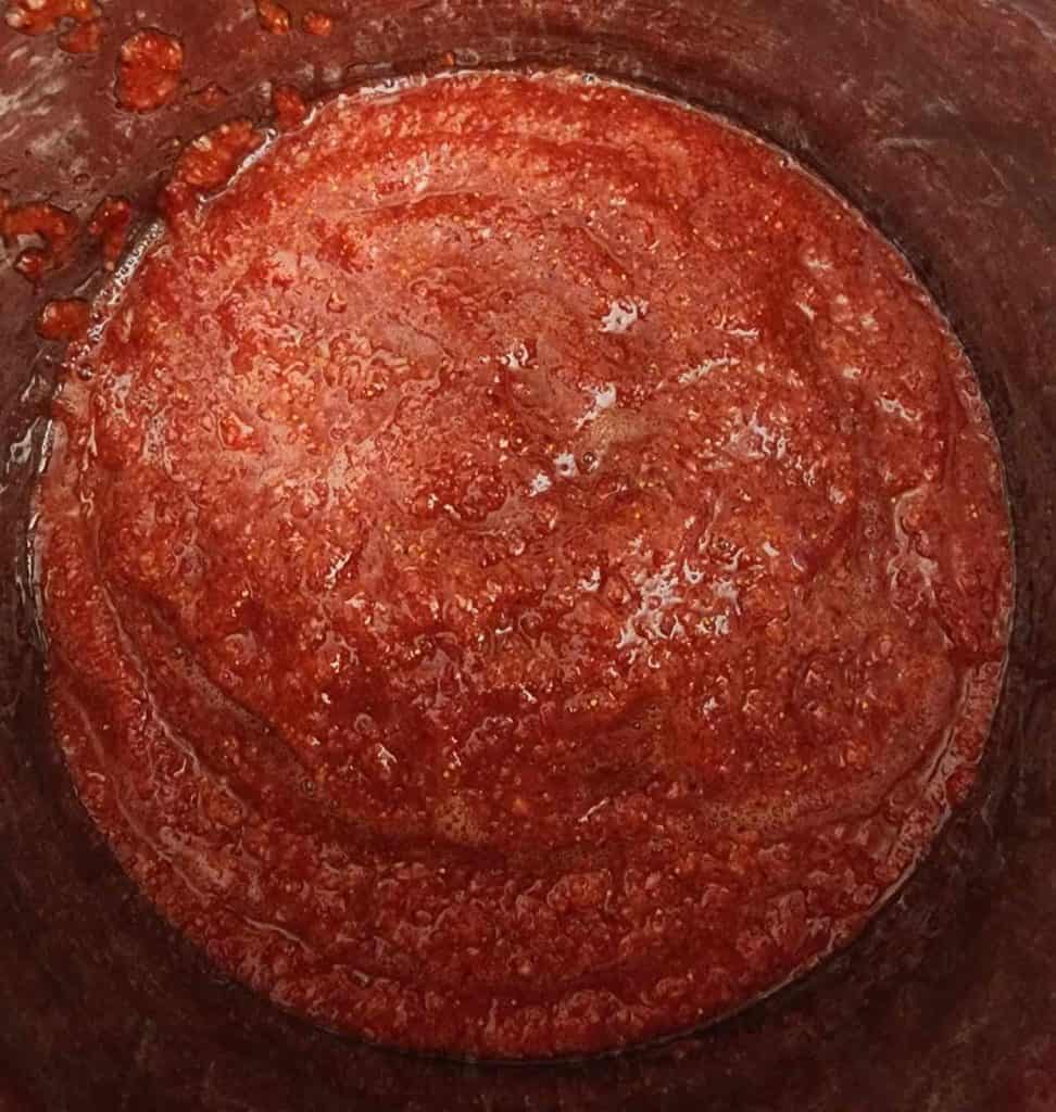 strawberry jalapeno bourbon bbq sauce simmering in pot