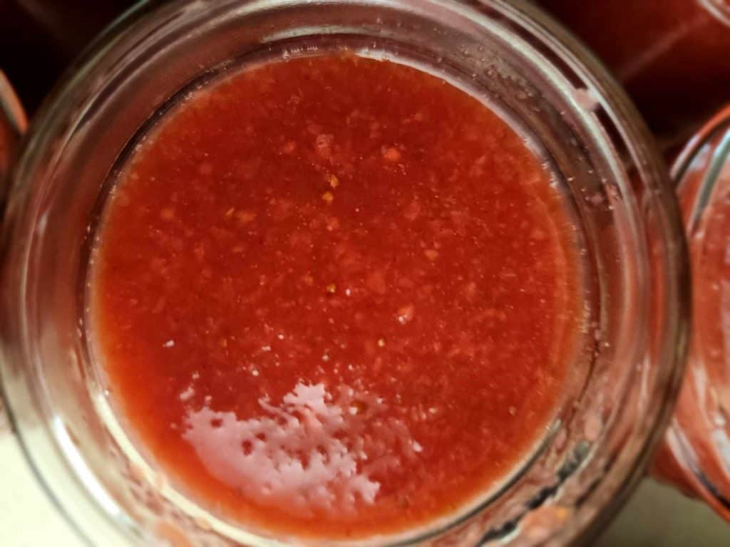 top of jar of strawberry jalapeno bourbon bbq sauce