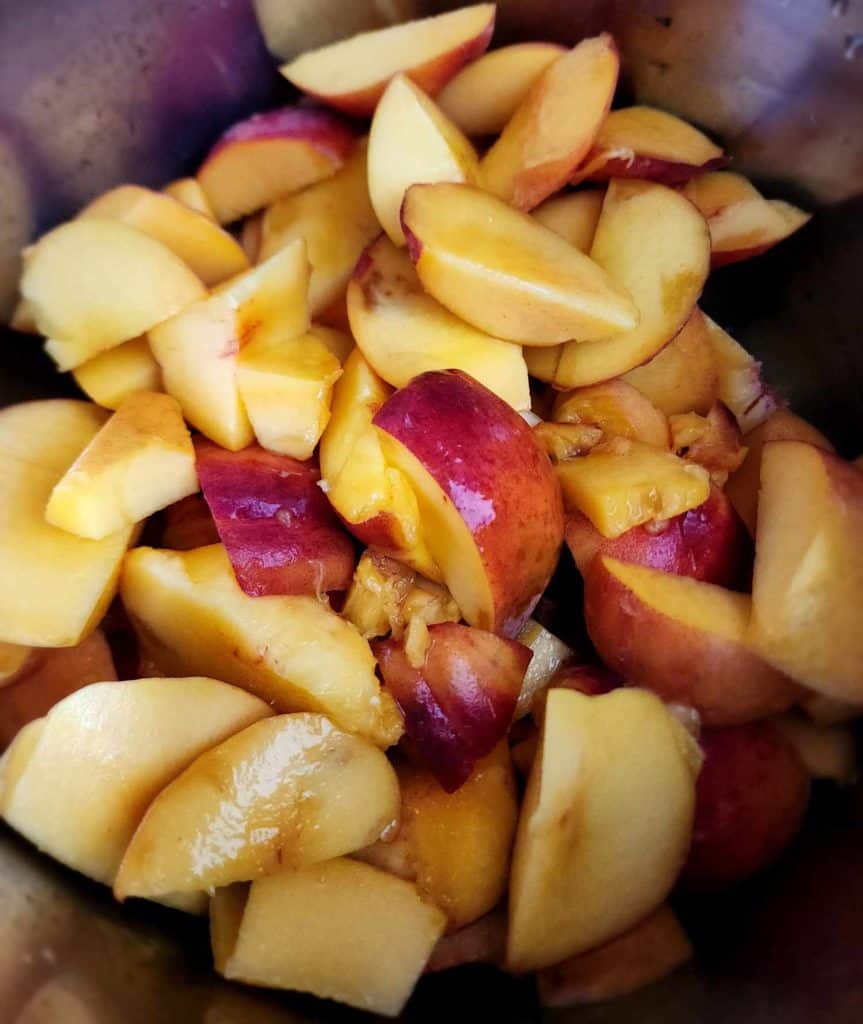 Adding sliced peaches to instant pot to make peach butter