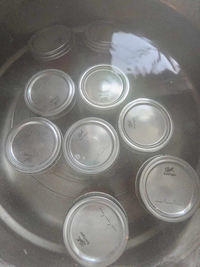 jars of homemade BBQ sauce in the canner
