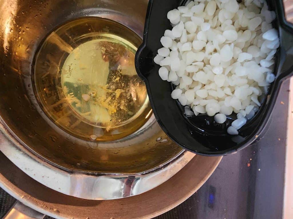 Adding beeswax for sage and rosemary lotion bars