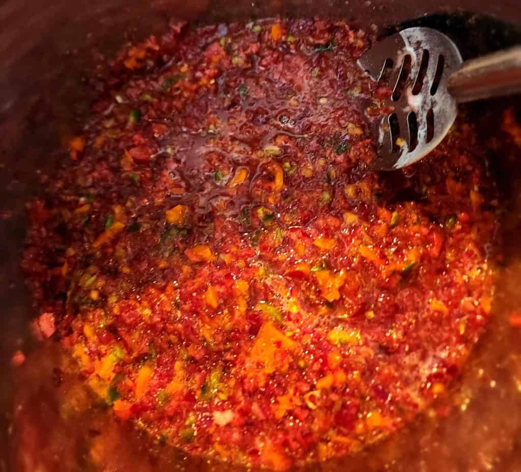 Stirring cherry jalapeno jelly mixture