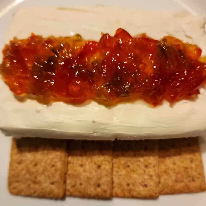 Christmas pepper jelly with cream cheese and cracker