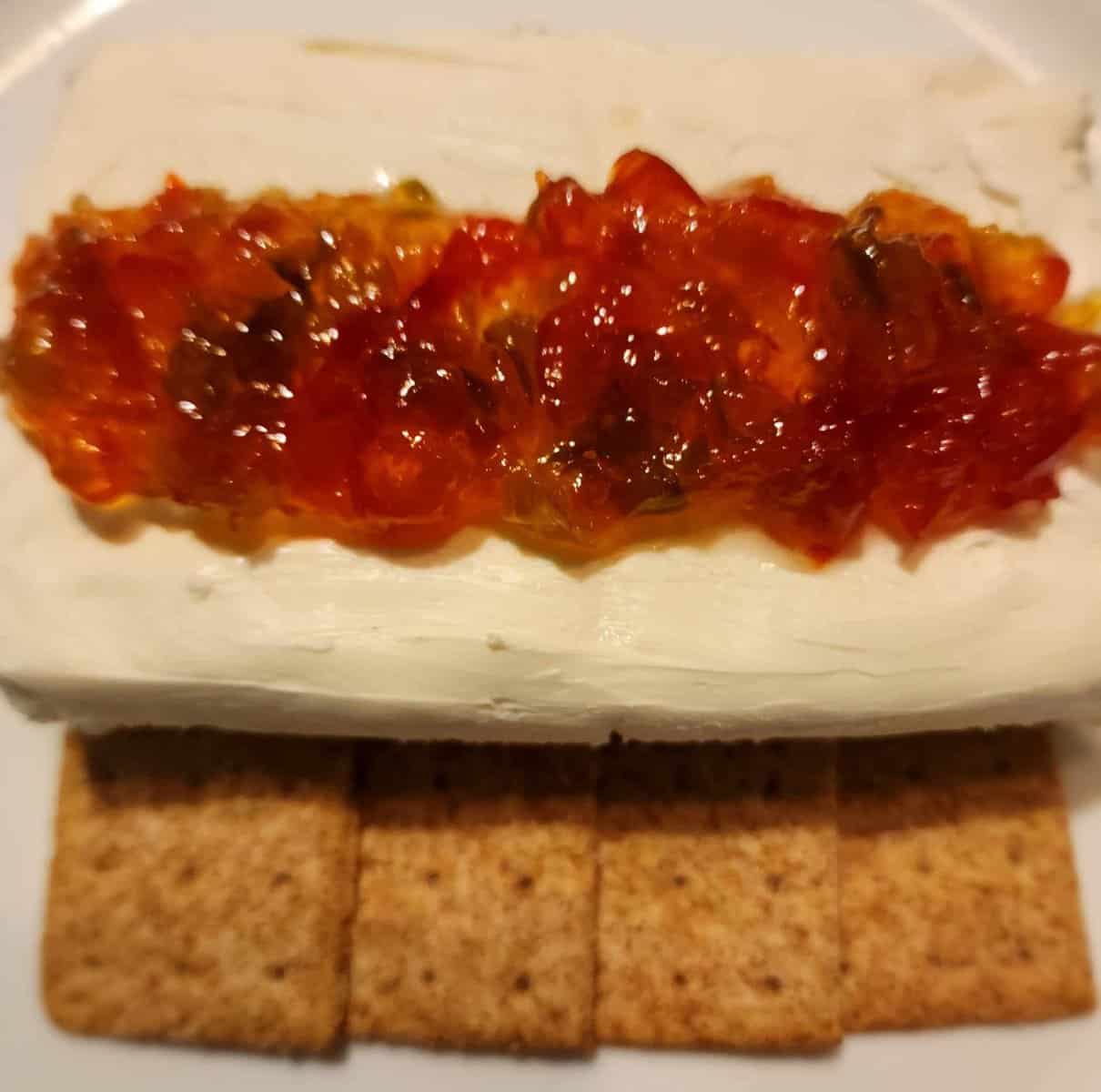 Christmas pepper jelly with cream cheese and cracker