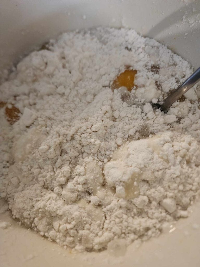 mixing the cake mix by hand to make the Halloween Cake