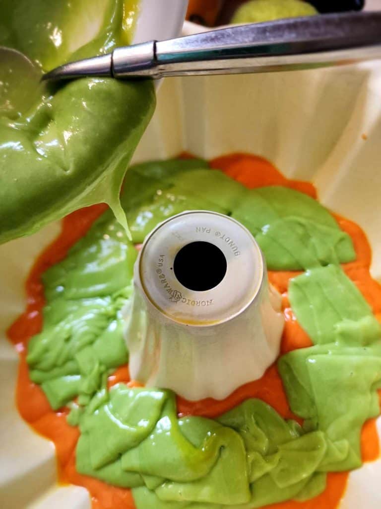 Adding the green cake mix to the Halloween Cake