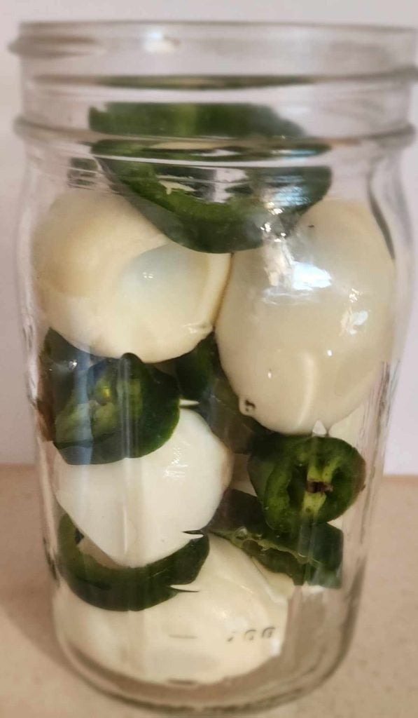 layered eggs with jalapenos for spicy cajun pickled eggs