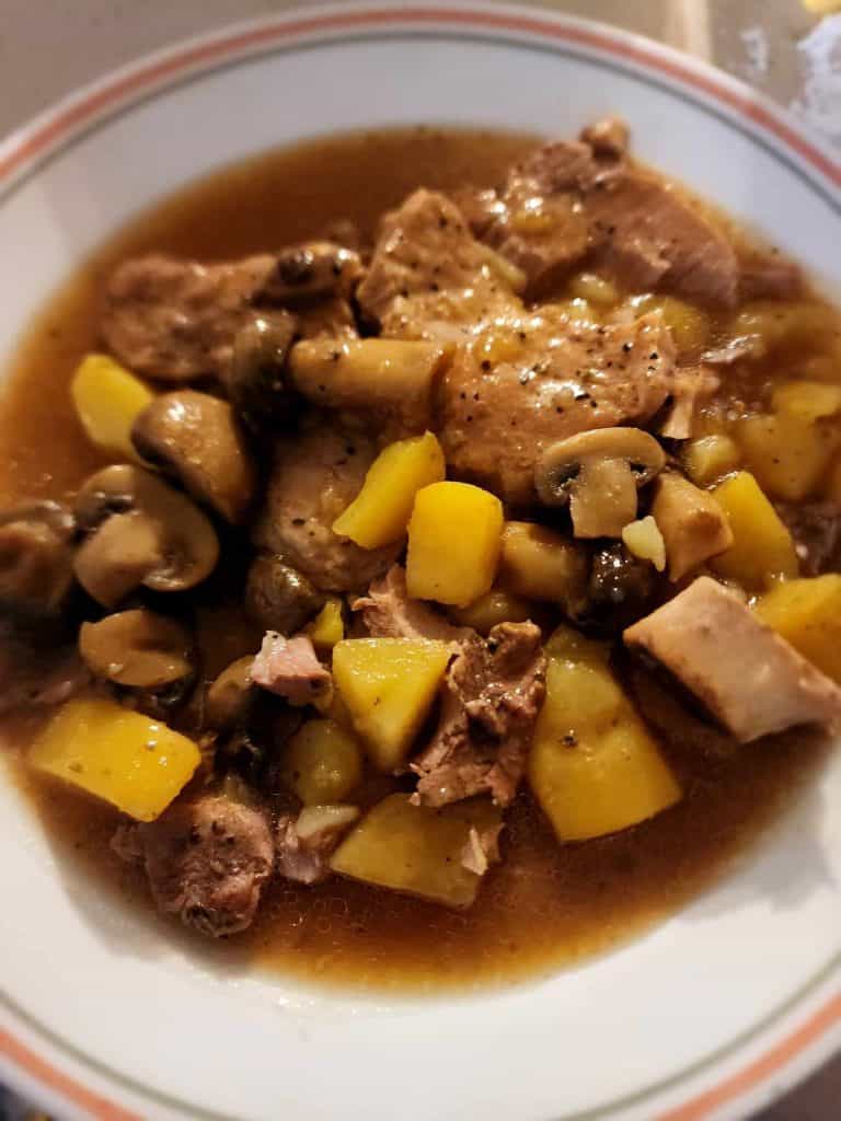 pork chops, potatoes, and mushroom instant pot recipe on a plate