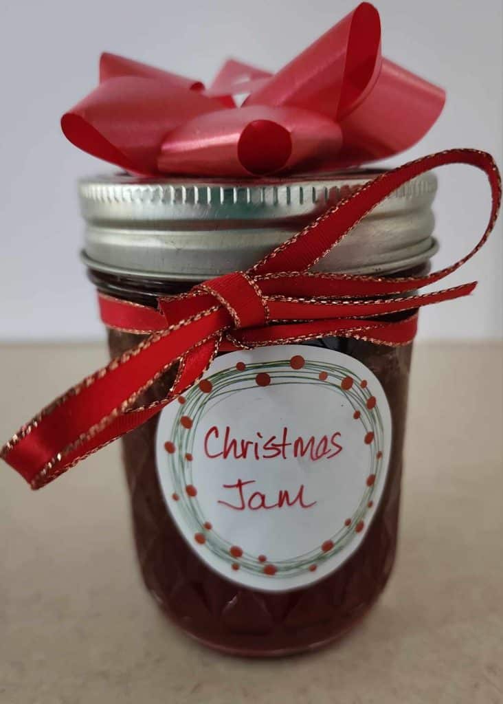 Jar of Christmas Jam with a ribbon and bow