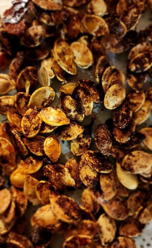 Sweet and salty pumpkin seeds after roasting on pan