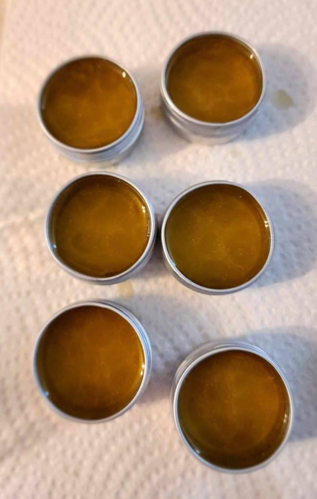 Pouring the liquid lip balm into the tins