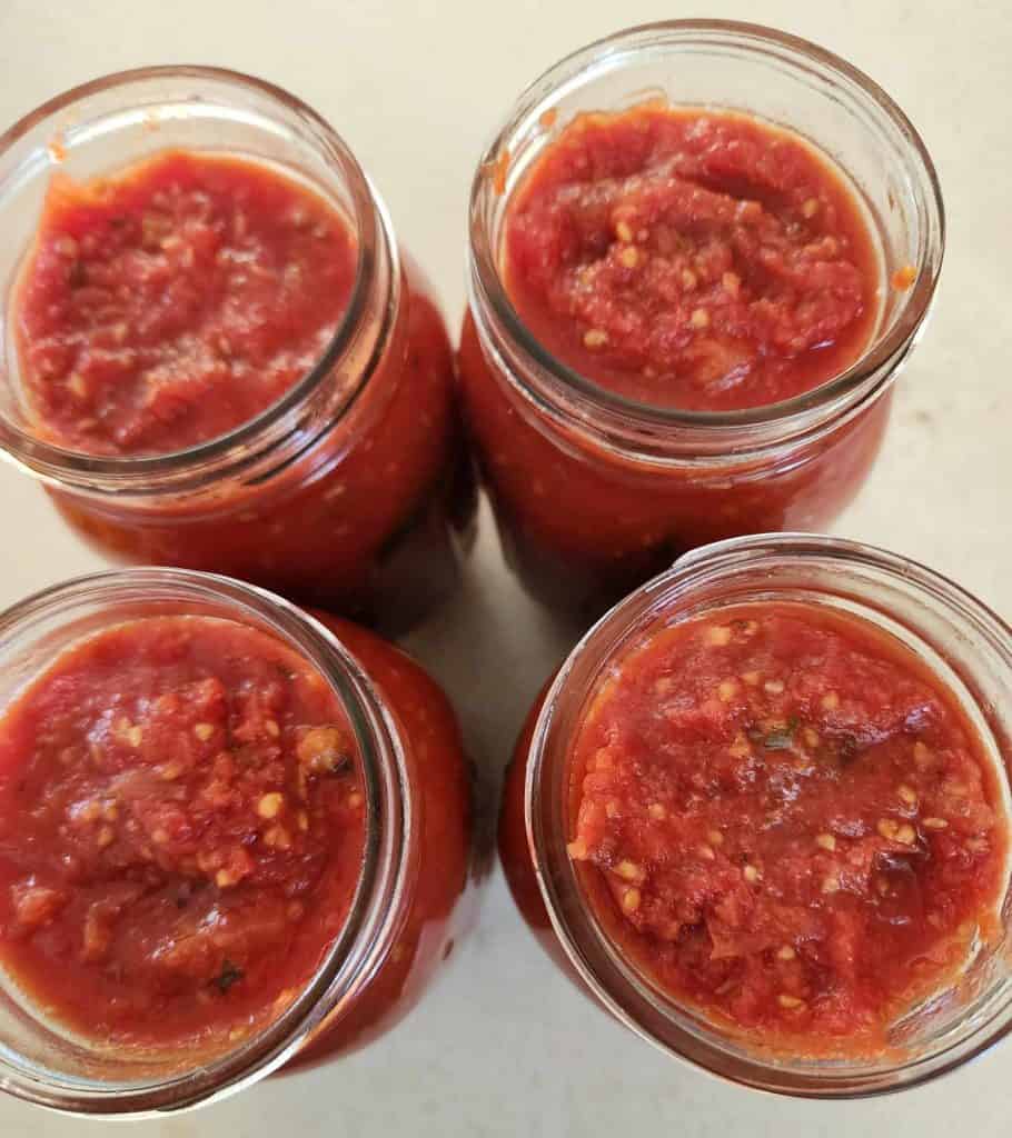 pizza sauce placed in jars for canning