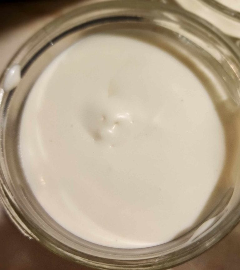 The calendula whipped body butter stored in jar