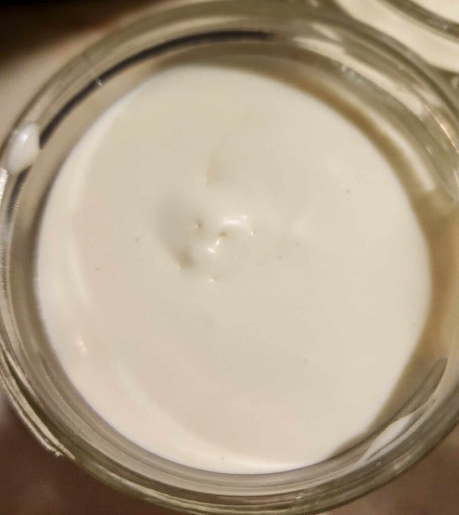 The calendula whipped body butter stored in jar