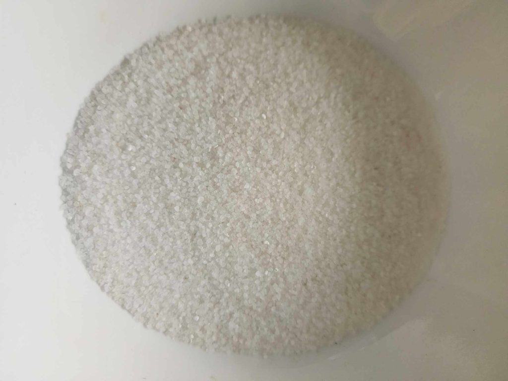 sea salt added to a large bowl to make sea salt scrub
