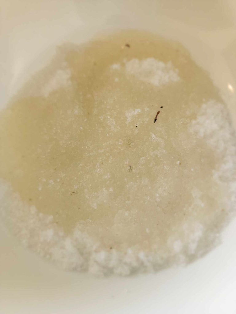 lilac infused oil added to dead sea salt to make lilac salt scrub