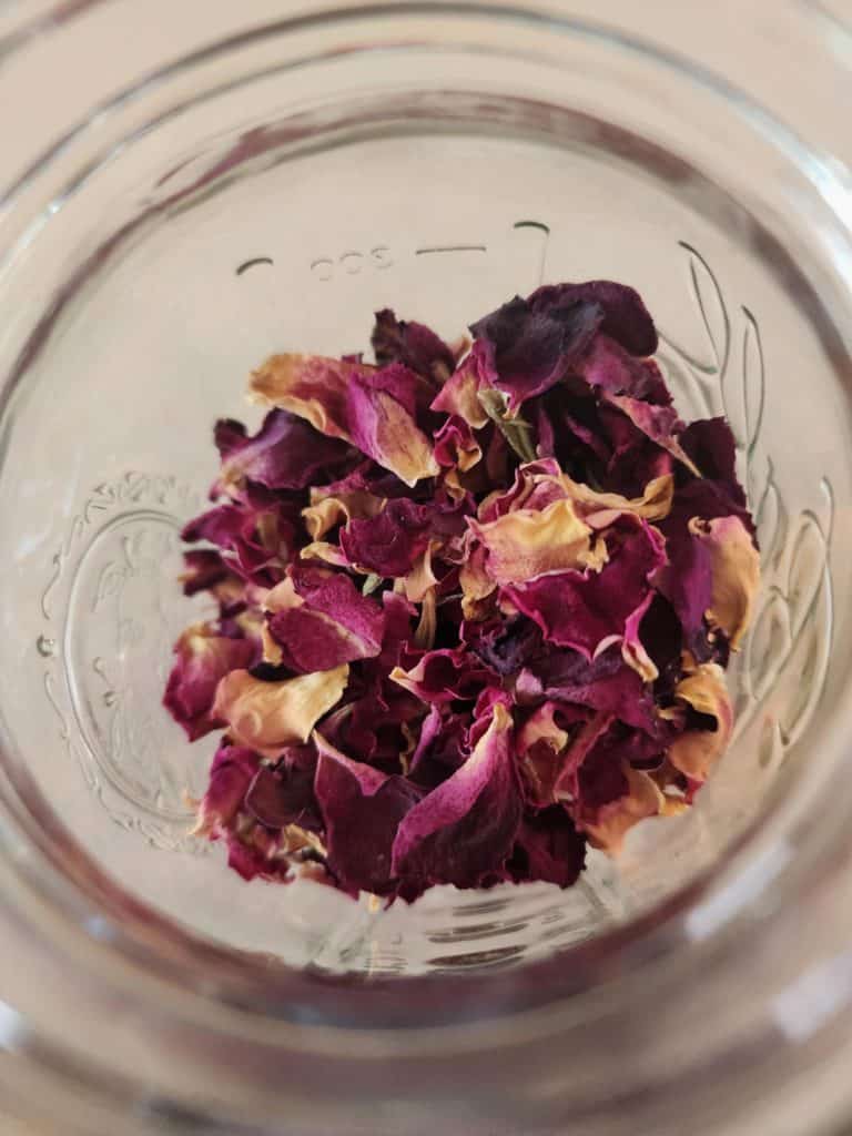 dried rose petals in a jar to make rose oil