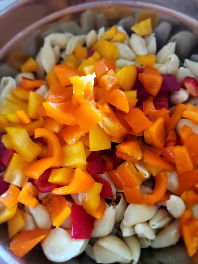 Multi-colored bell peppers added to ranch pasta salad