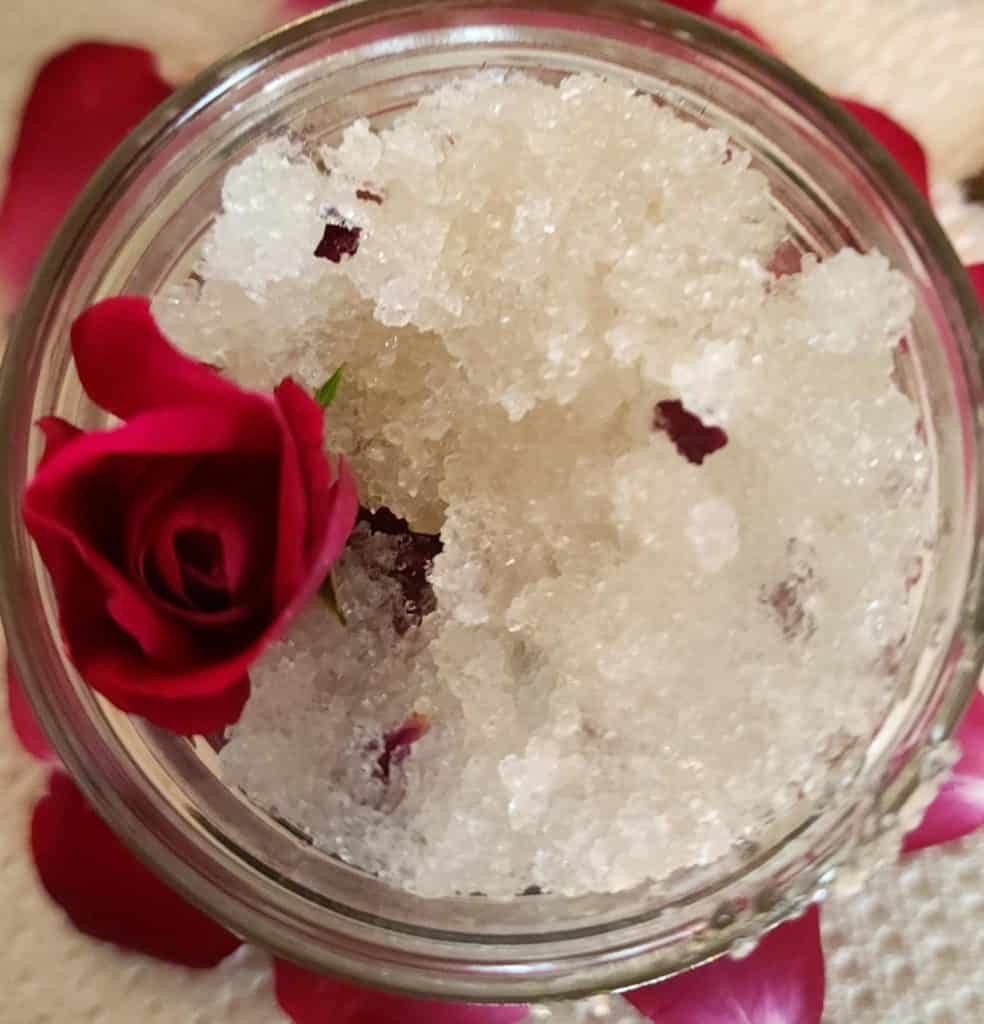rose salt scrub in a jar with rose bud