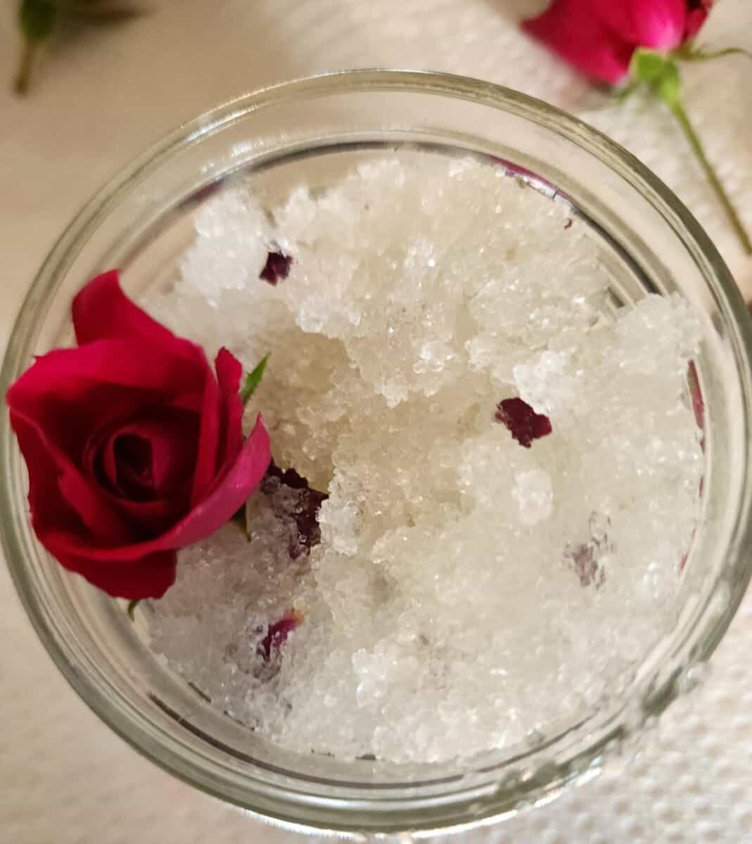 rose salt scrub in jar with rose bud