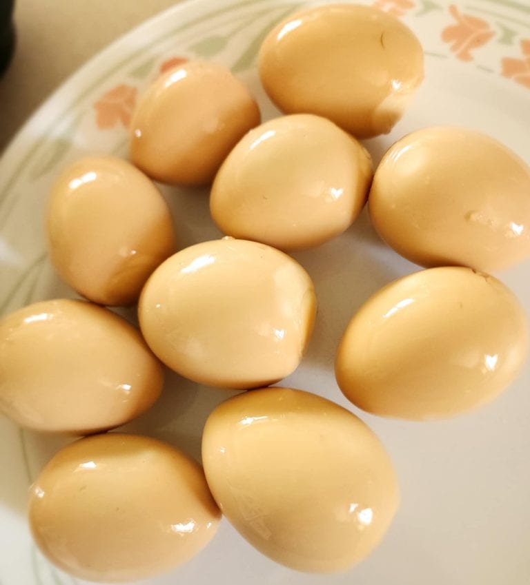 Smoky pickled eggs on a plate