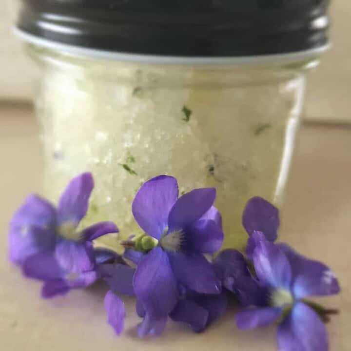 violet salt scrub with flowers