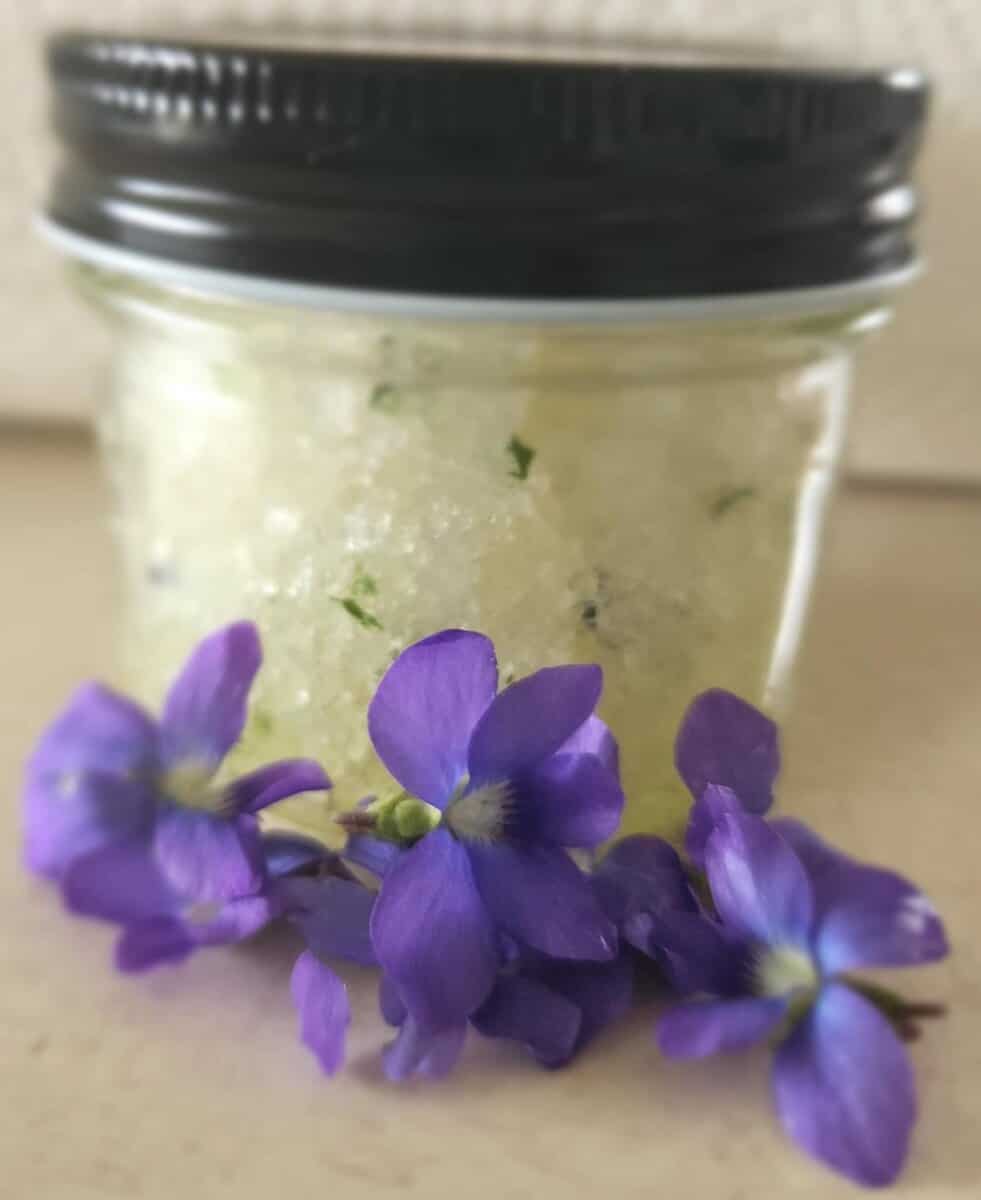 violet salt scrub with flowers