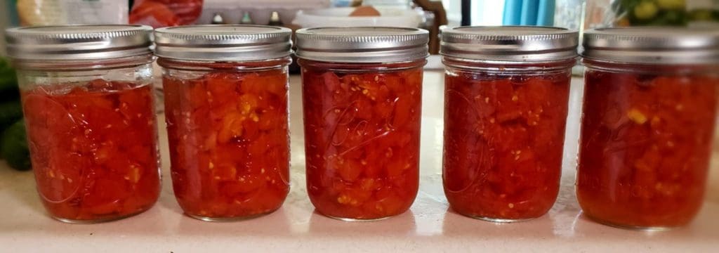 jars of diced tomatoes on counter