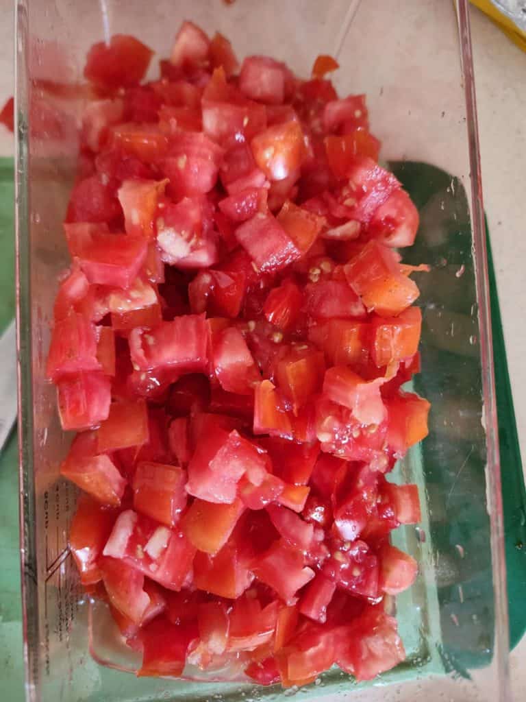 diced tomatoes in vegetable chopper.