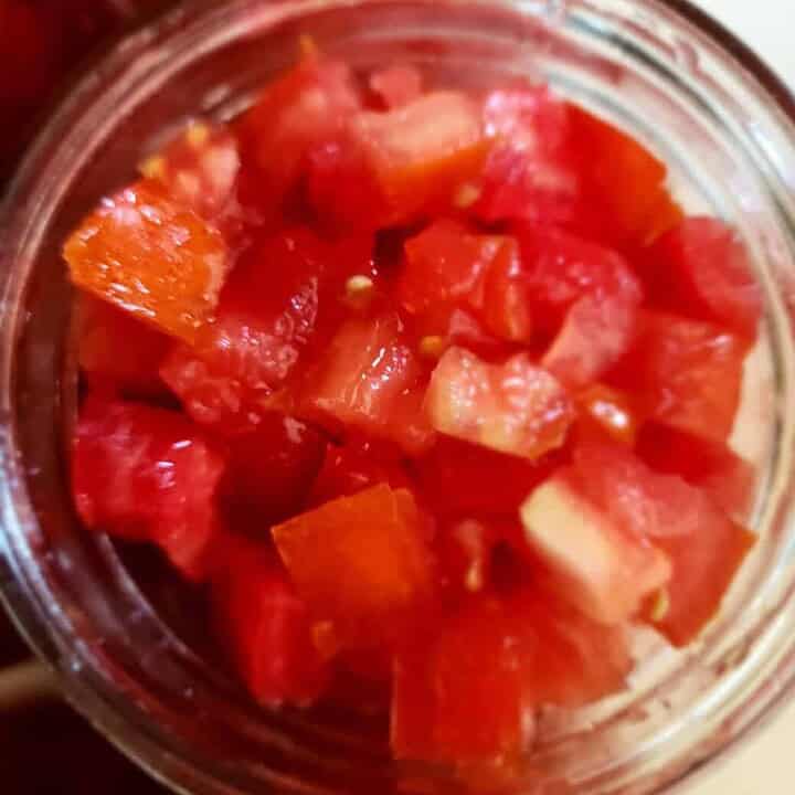 jar filled with diced tomatoes from the top of the jar