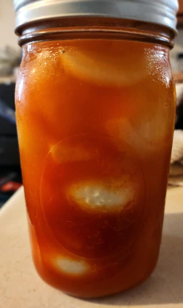 sriracha pickled eggs after being in refrigerator