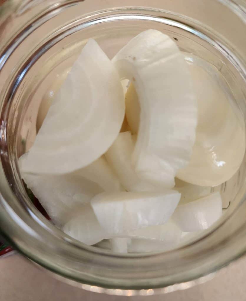 onions and eggs from top of jar for sriracha pickled eggs