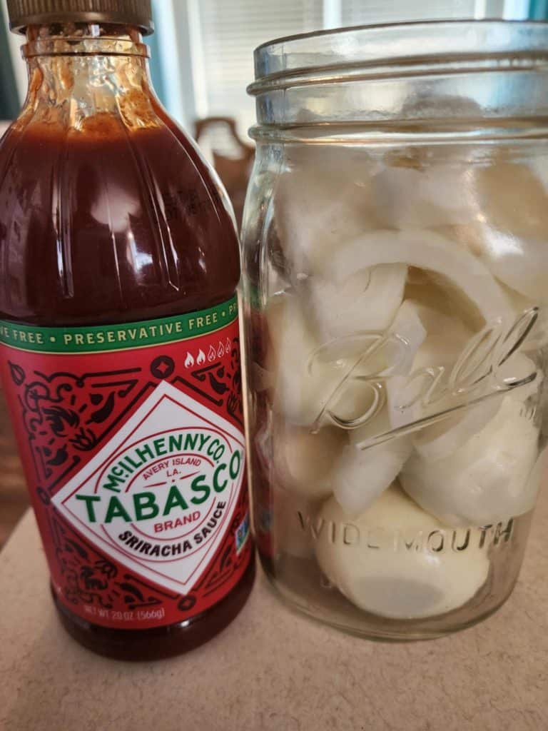 sriracha sauce and jar of eggs