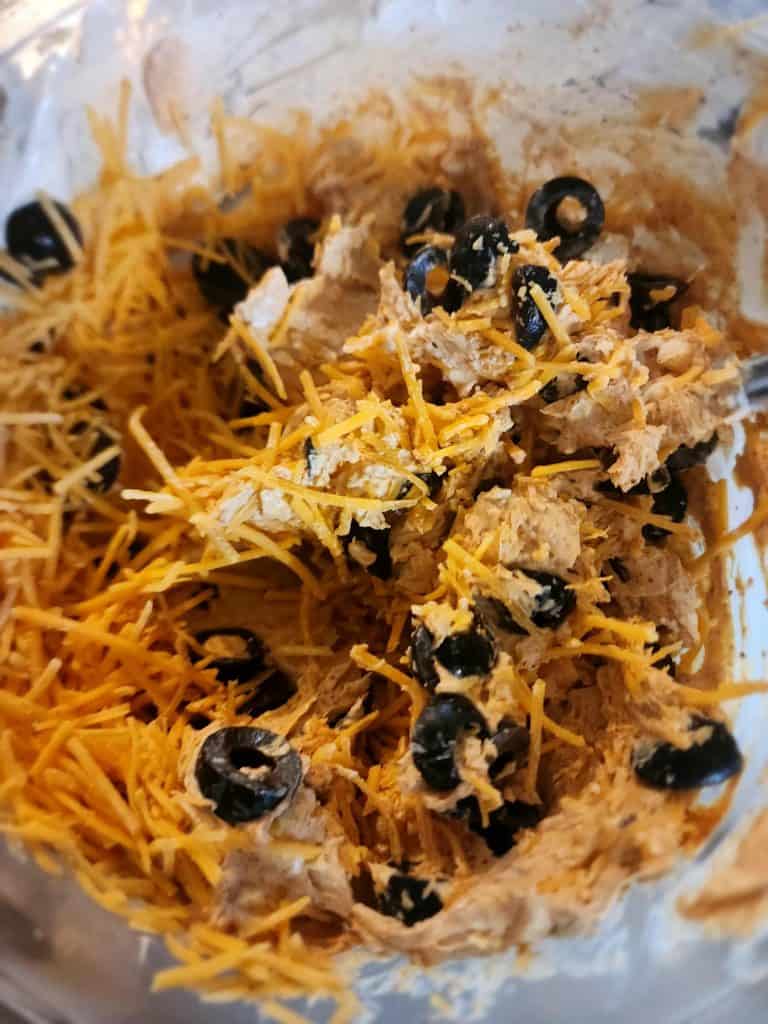 Adding ingredients to Mexican roll ups