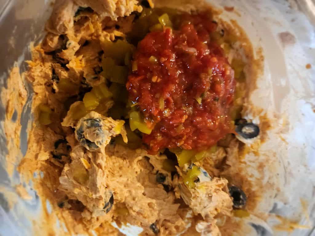 Adding ingredients to Mexican roll ups
