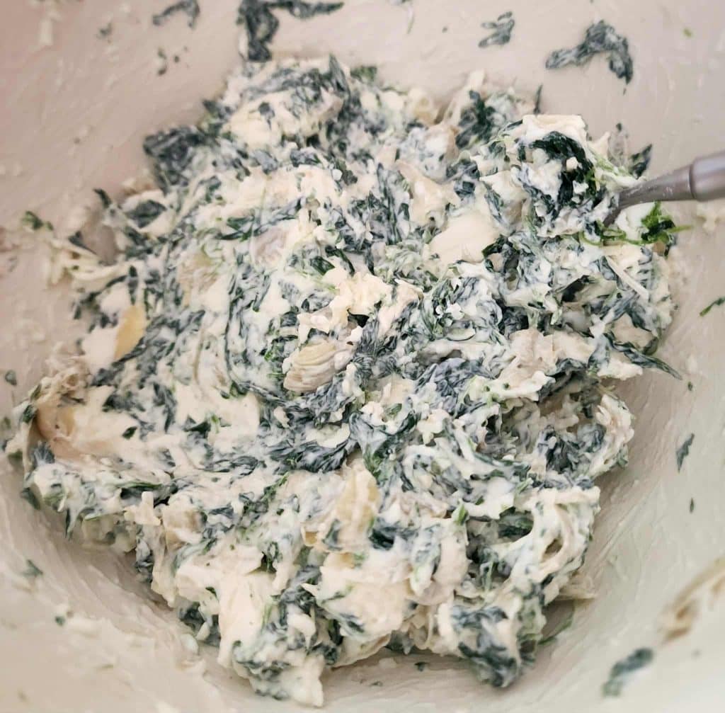 spinach dip ingredients mixed together for spinach dip roll ups