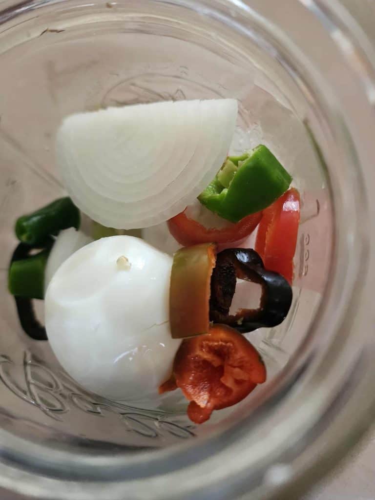 eggs peppers and onions layered in jar from the top