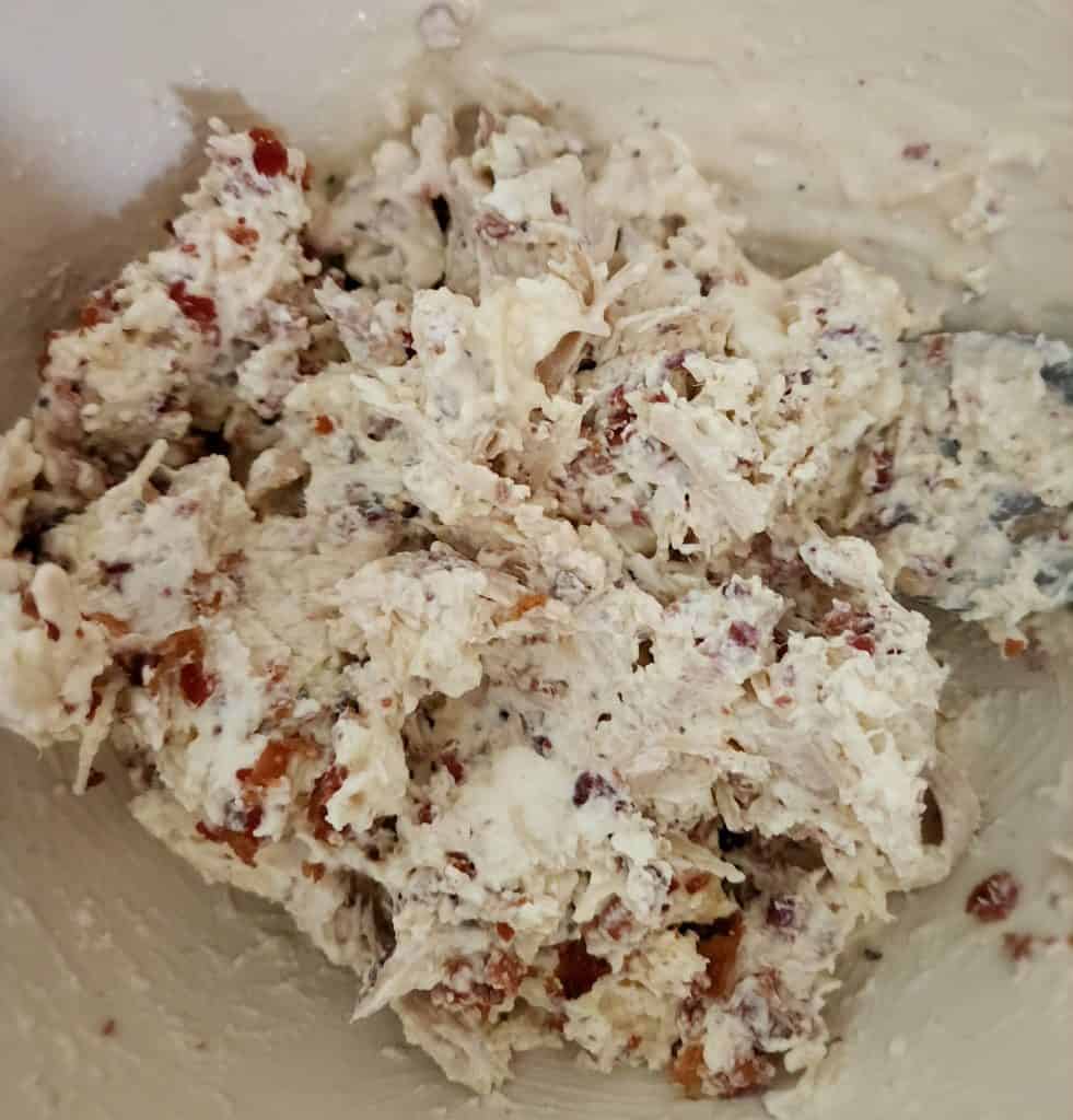 mixture of cream cheese caesar dressing cheese for Caesar chicken roll ups